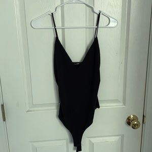 Deep v-neck black body suit